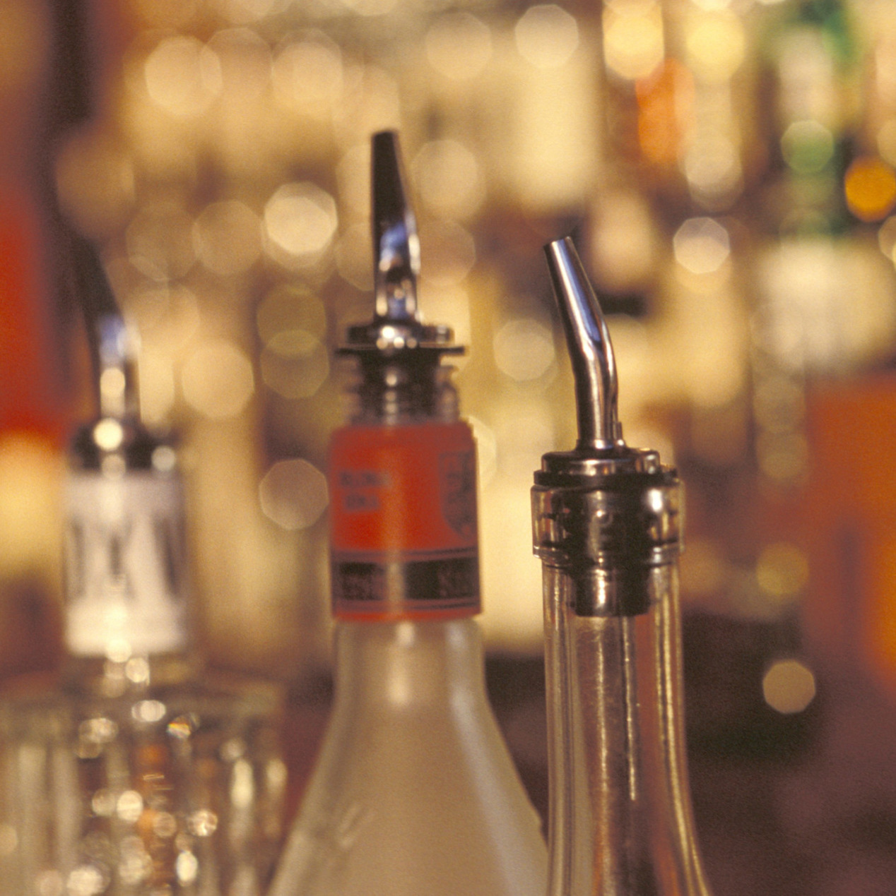 spirits bottle tops in a bar